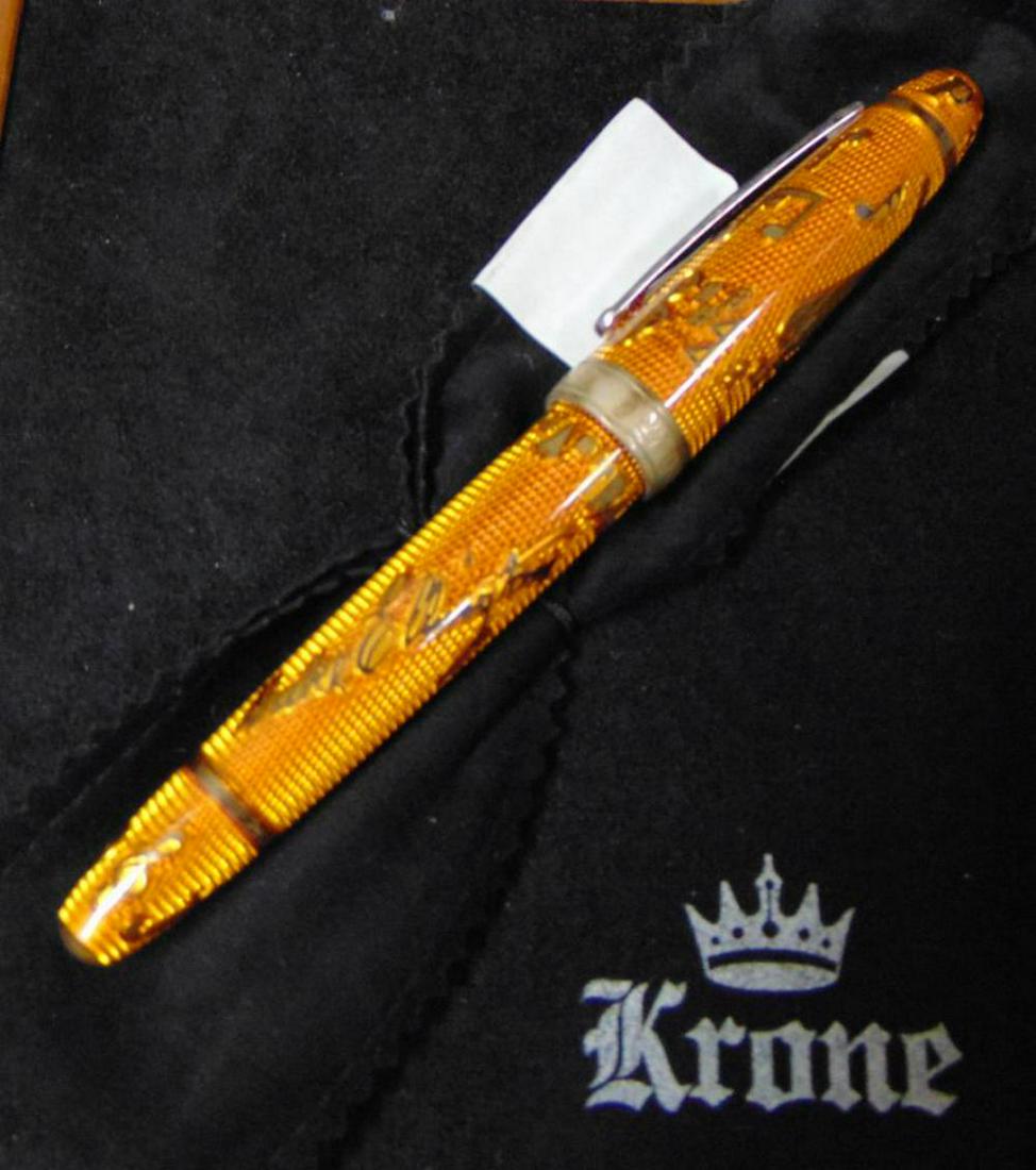 Krone Duke Ellington Fountain Pen: Sterling silver fountain pen decorated with orange lacquer. Encircling the barrel is Ellington's signature, an inset of his piano, and the musical notes from his best-known work, "Take the 'A' Train".
