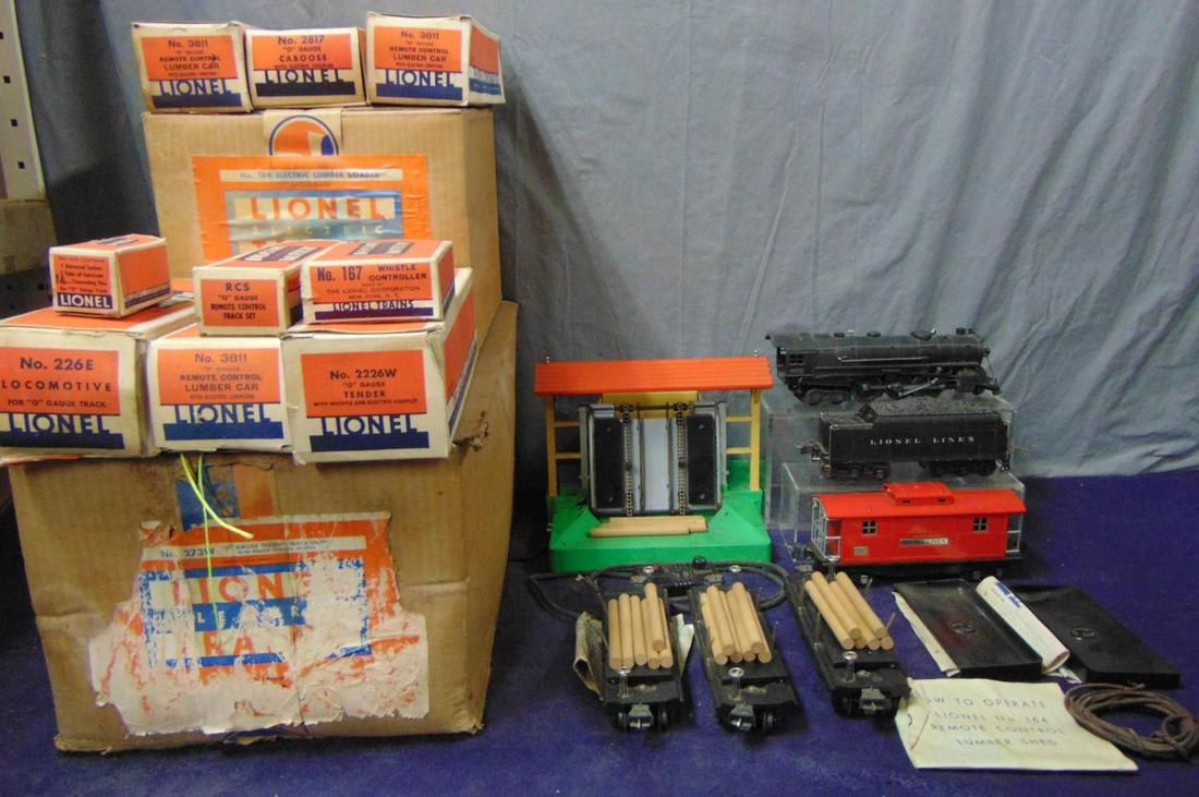 Scarce Boxed Lionel 226E Set 273W: Nice original owner item, 1940. Includes a 226E Hudson Loco with cotton wrap, clear cellophane wrap; 2226W diecast whistling tender, both match nicely; 3 #3811 Log Dump Cars, all with logs, instructio