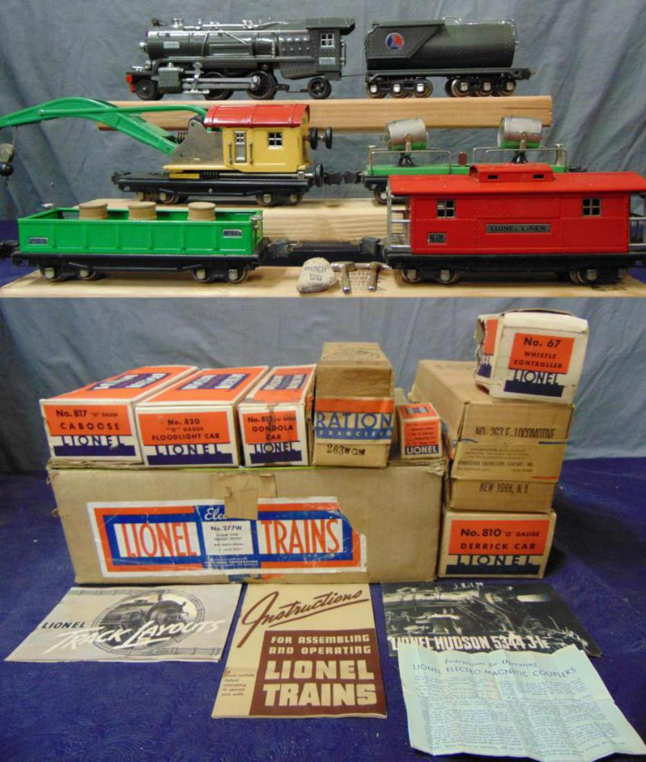 Nice Boxed Lionel 263E Work Train Set 277W: Nice original owner item, 1937. Includes a 263E steam loco, clean, bright & shiny. Wheels turn freely; 2263W Vanderbilt whistling tender, bulk head lightly fatigued; 2812 gondola with 2 tools and 2 sp