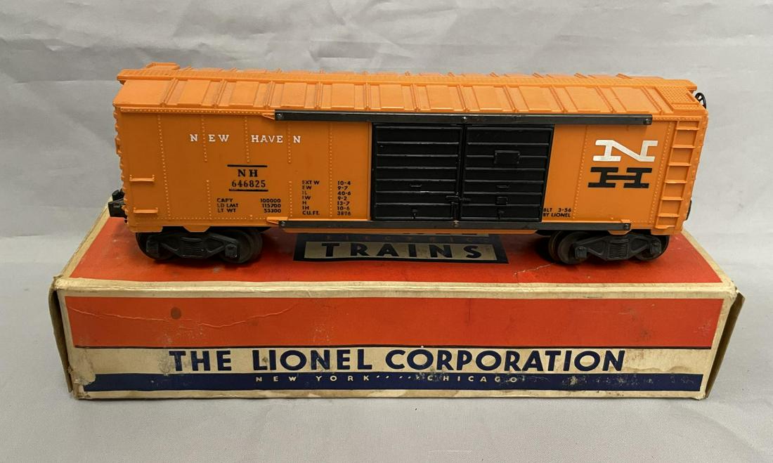 Nice Boxed Lionel 6468-25 White N Boxcar: Nice clean reverse lettered NH double-door boxcar. It is the correct unpainted body with whit N. It shows light playwear with box. From The Estate Collection of Neil Padron.