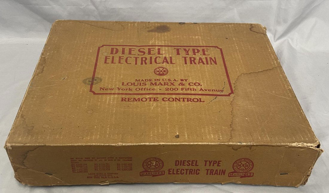 Clean Boxed Marx SF Set 45225: Includes a litho tin 21 Sf F3 AA diesel with intact horns; GAEX Boxcar; C&O High Gondola; Shell tank car; 1951 ATSF Caboose, cars are litho tin with sheet metal side-frame trucks. Trains show light pl