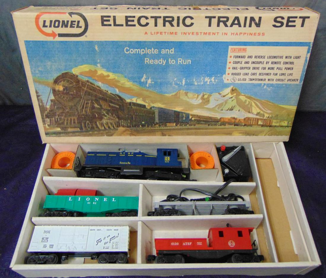 NMINT Boxed Lionel 634 Set 11530: 1965. Includes a 634 ATSF NW2 Diesel; 6401 Flat with Reels; 6142 Gondola with canisters; 6014 Frisco Boxcar; 6130 SF Work Caboose, 1012 Transformer, all paperwork. Missing track, All trains appear UNR