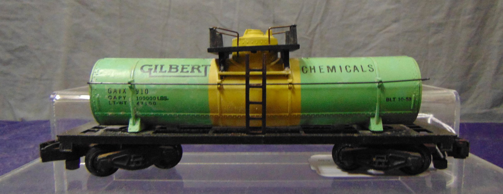 American Flyer 910 Gilberts Chemical Tank Car: S Gauge. Intact example that would benefit from a cleaning. It shows light playwear. From the Frank Pisani Collection.