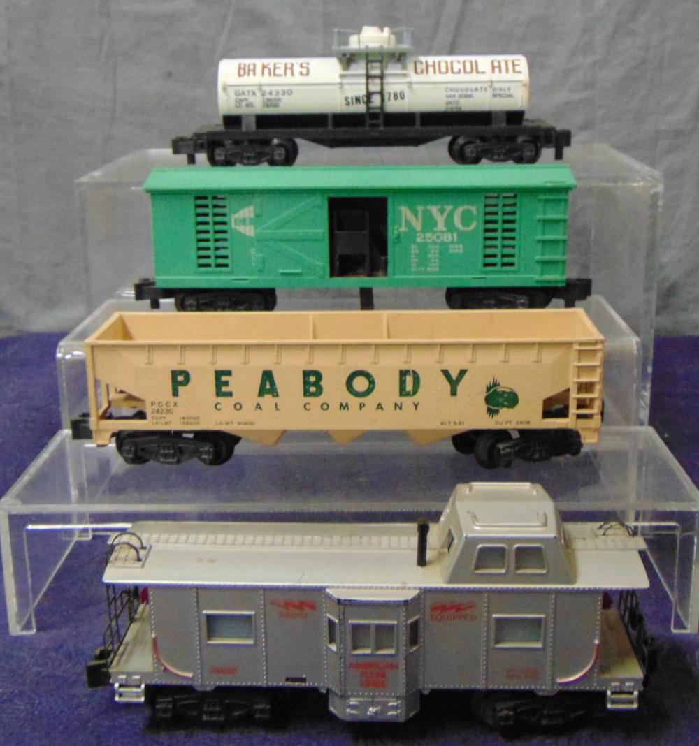 4 American Flyer Late Freight Cars: S Gauge. Includes a 24330 Baker’s Chocolate Tank; 25081 NYC Hay Jector; 24638 Bay Window Caboose; 24230 Peabody Hopper. All are intact with PM trucks, but would benefit from a cleaning. From the Fra
