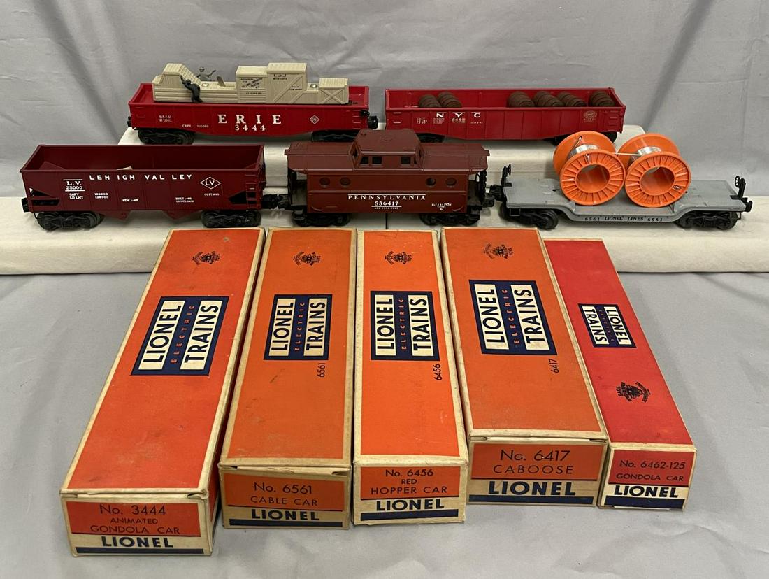 5 Clean Boxed Lionel Freight Cars: Includes a 6417 PRR N5C Caboose; 3444 Cop & Hobo Car; 6561 reel Car; 6456 LV Hopper with inspection label; 6462-125 Gondola with barrels with inspection label. All show light very light runtime with c