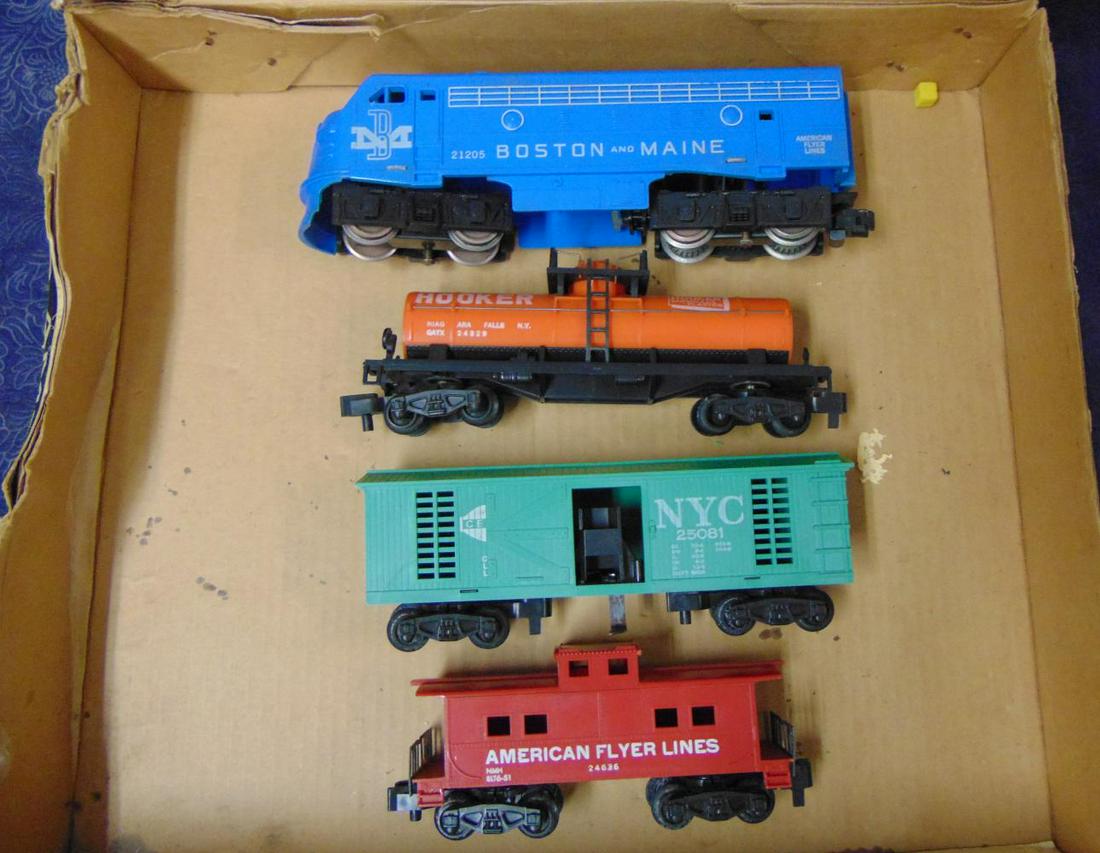 Boxed American Flyer 20715 F9 Freight Set: S Gauge. Includes a 21205 B&M F9 diesel, intact and clean, missing nose sticker; 24329 unpainted Hooker tank car; 25081 NYC Hay Jector with 2 bales; 24636 Caboose. All have PM trucks and show light ru