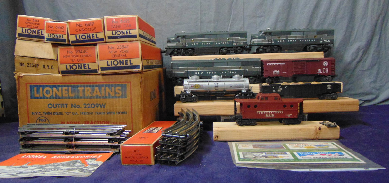 Boxed Lionel 2354 ABA Set 2207W: 1953. Includes a nice 2354 NYC F3 ABA Diesels. Nice matching graphics and nose decals, battery box is clean; 3484 PRR operating Boxcar; 6462 gondola with drums; 6415 3-d tank car; 6417 PRR N5c Caboose