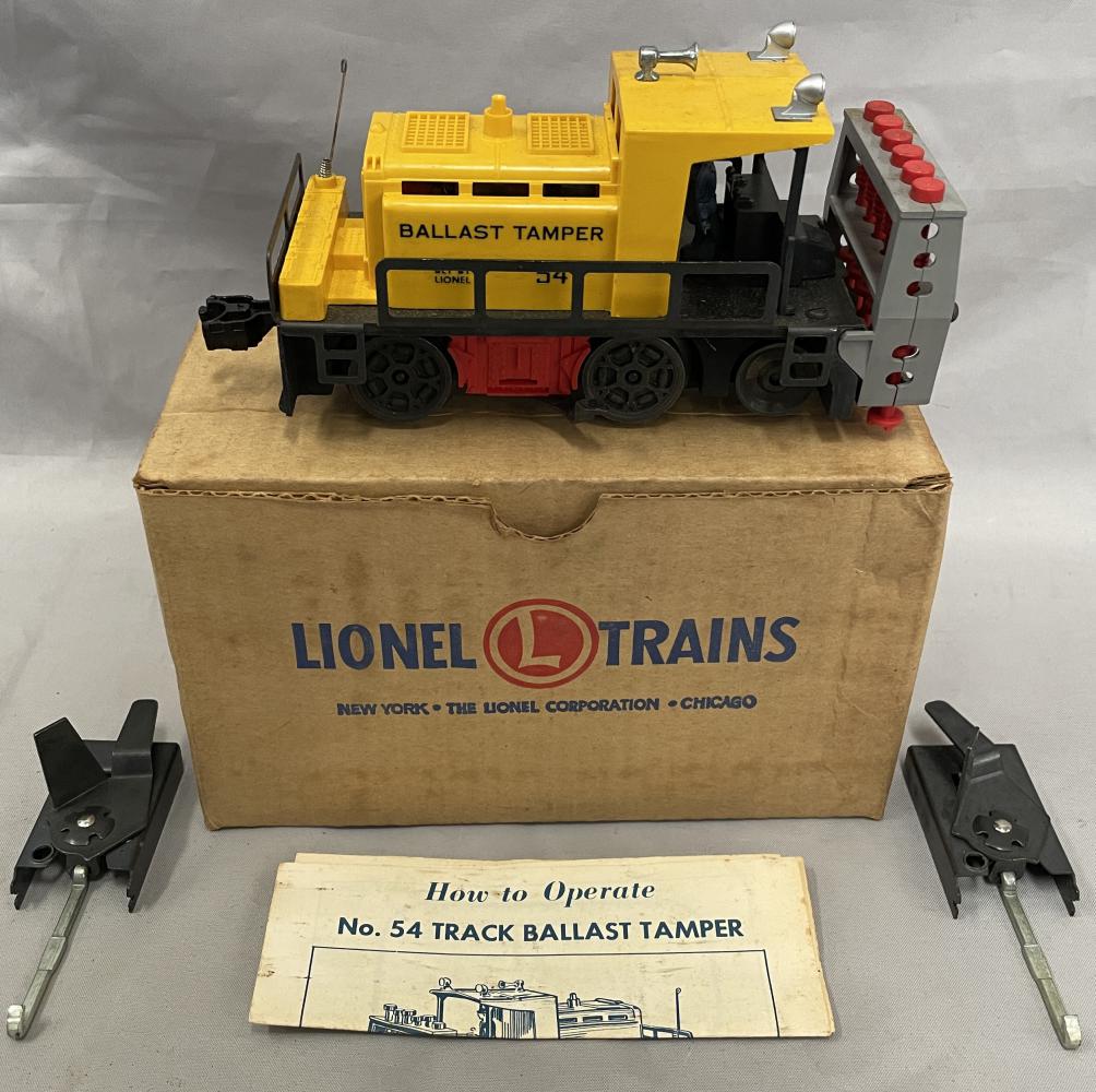NMINT Boxed Lionel 54 Ballast Tamper: Fairly Clean Example with 2 trips. It would benefit from a light cleaning and is is UNRUN with instructions, insert and a clean box.