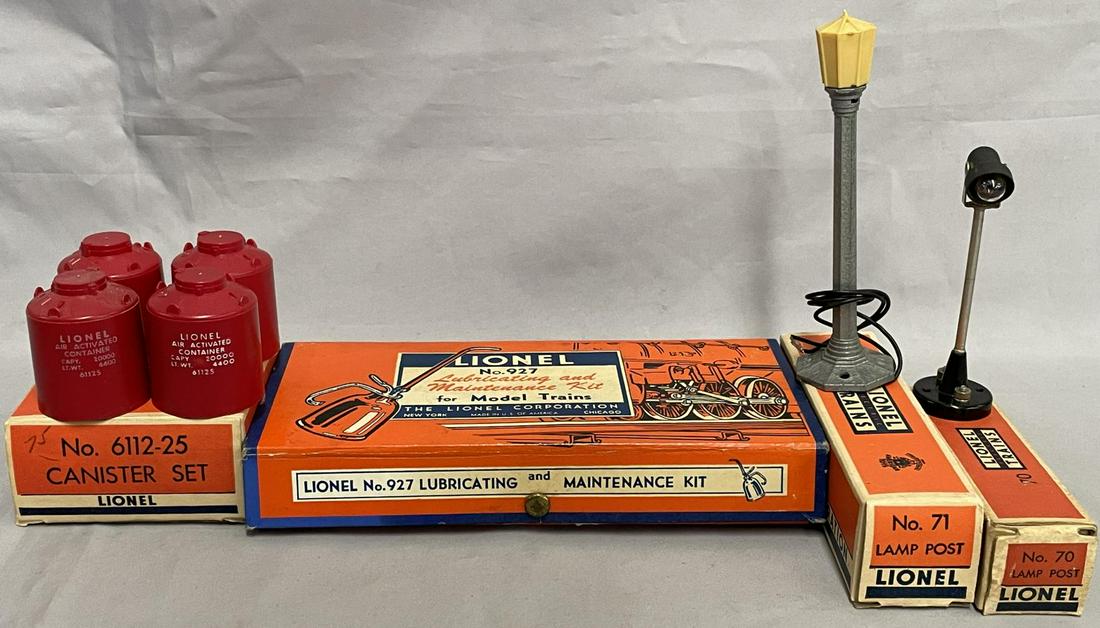 4 Boxed Lionel Accessories: Includes a 70 Yard Lamp; 71 Boulevard Lamp; 6112-25 4-canisters, r/s lettering, all like new; 927 Lube kit, complete with fluid in can and instructions, lightly used. All have nice boxes.