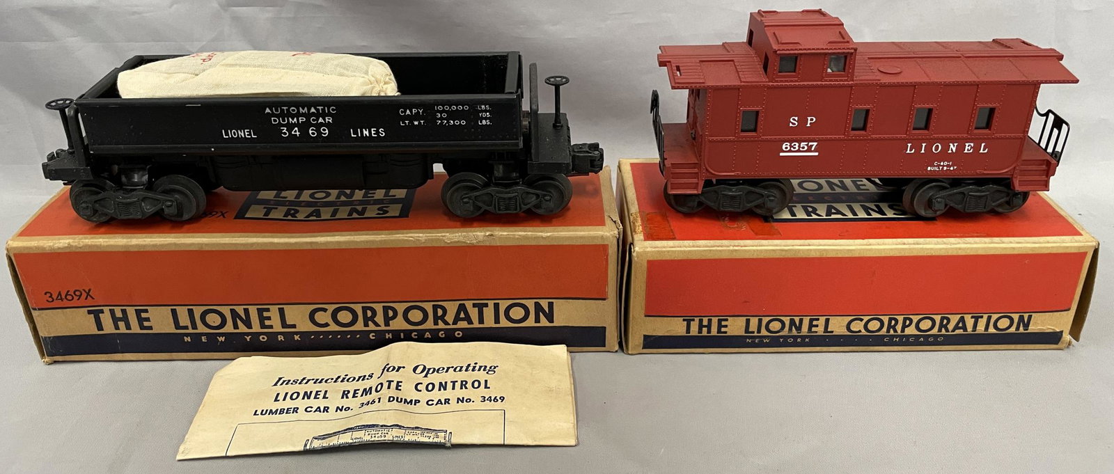 NMINT Boxed Lionel 3469X & 6357 Freights: Includes a 3459X Coal Dump car with 207, unrun, worn box; 6357 Caboose, tile red variation, UNRUN in nice box. WOW!