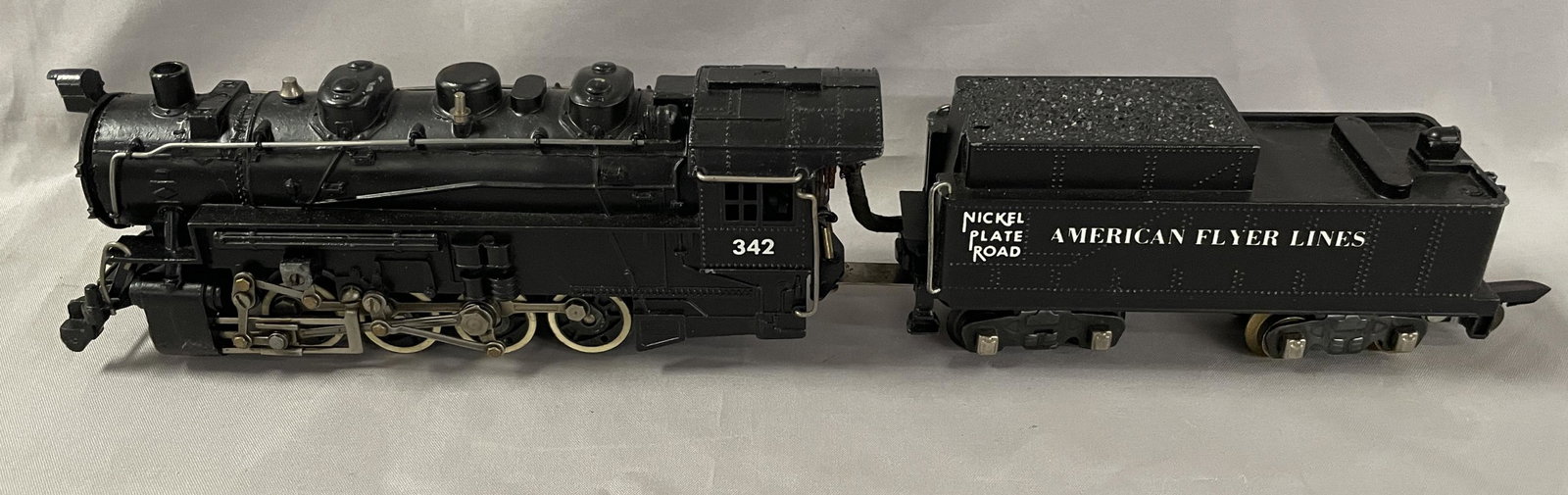 Nice American Flyer 342 NPR Switcher: S Gauge. Nice 0-8-0 switcher & tender with super bright lettering and clean rods. It shows light runtime. Nice example!