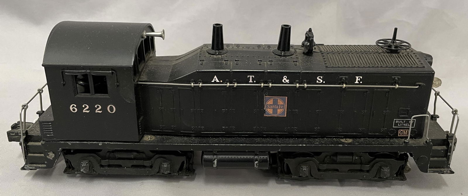 Lionel 6220 AT&SF NW2 Diesel with Bell: Nice example, showing light playwear with bell mechanism intact.