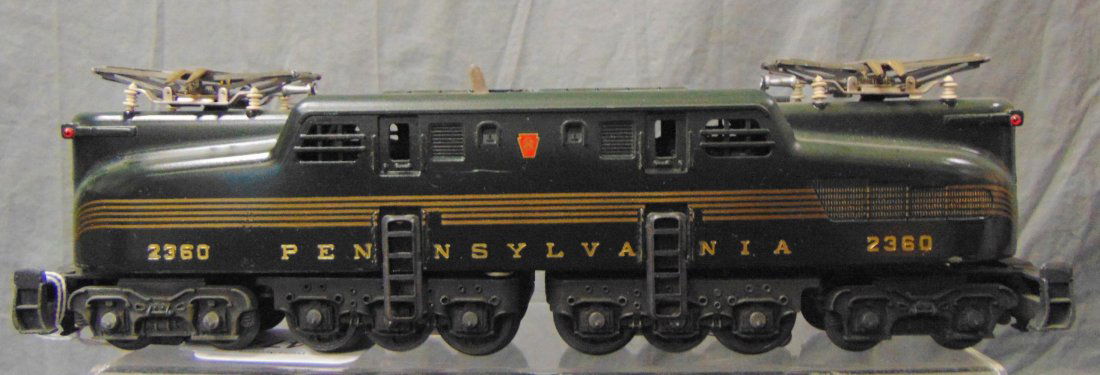 Nice Lionel 2360 PRR GG1: Dual Motor with Great stripes and decals, but...has been clear coated one side!!!! It show light runtime.