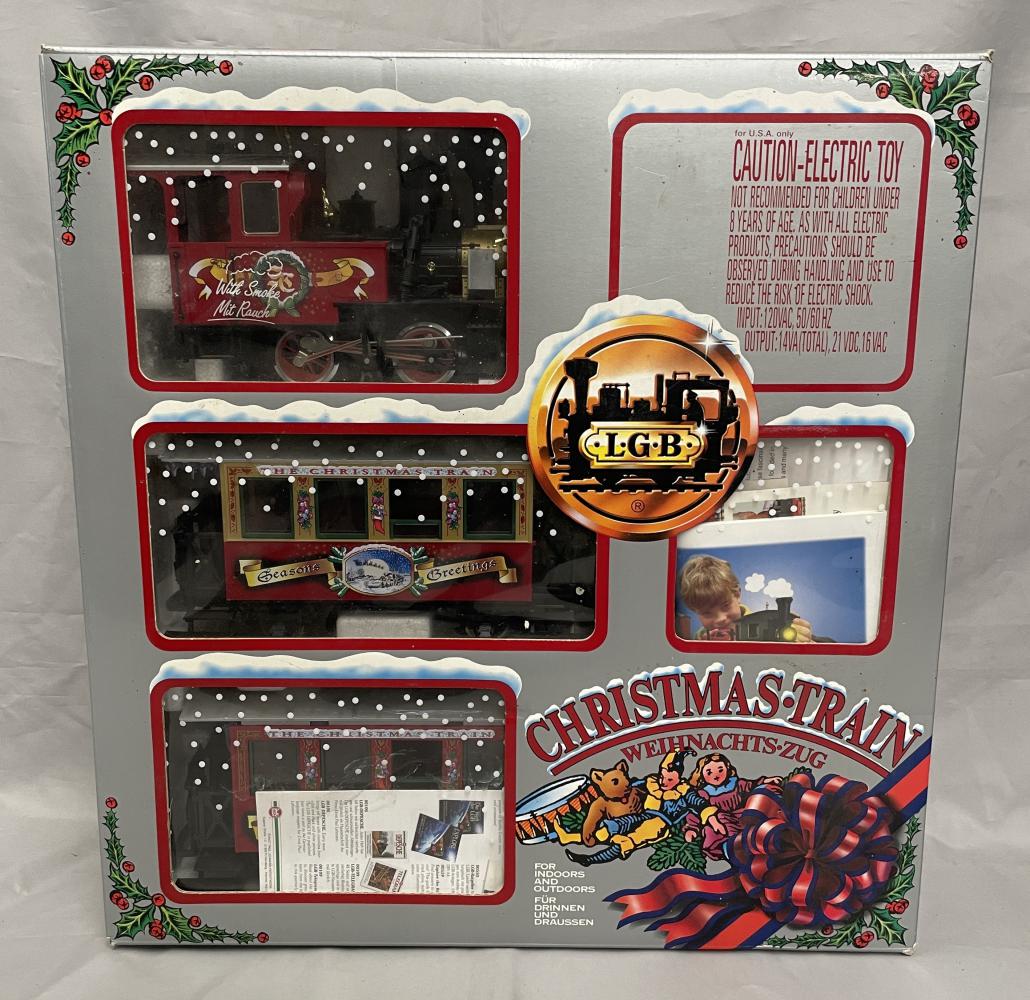 Boxed LGB 72534 Christmas Set: G GAUGE. Includes an 0-4-0 steam loco and 2 coaches, track, cord and paperwork. Missing some figures and transformer/ Shows some use with nice set box.