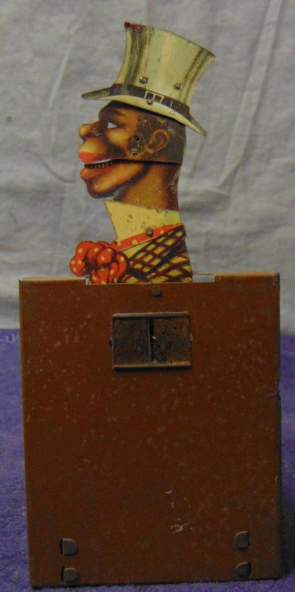 Scarce. Wind Up Black Americana Toy.: Tin Wind Up Man in Top Hat. When wound head moves and mouth opens and closes. Scarce.