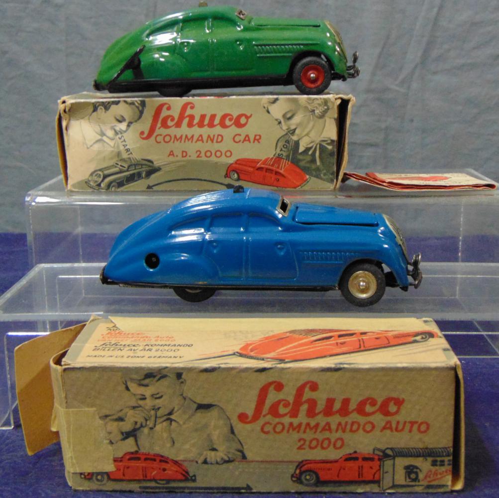 2 Boxed Schuco 2000 Commando Cars: Each is litho tin with functional mechanism. One has a key and instructions. They show light playwear with boxes showing wear and have flap issues.