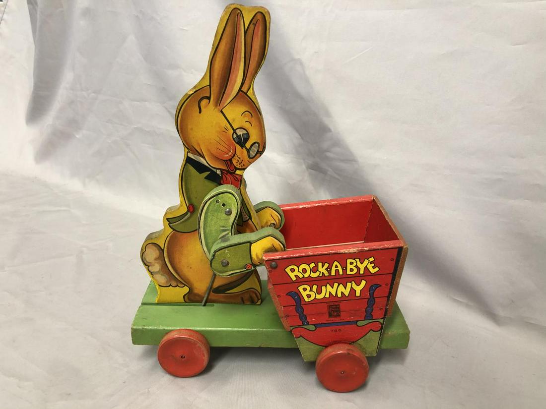 Fisher Price 785 Rock-A-Bye Bunny: Nice large animated rocking Bunny 12.5” tall. Paper litho on wood, just missing string, showing light playwear.