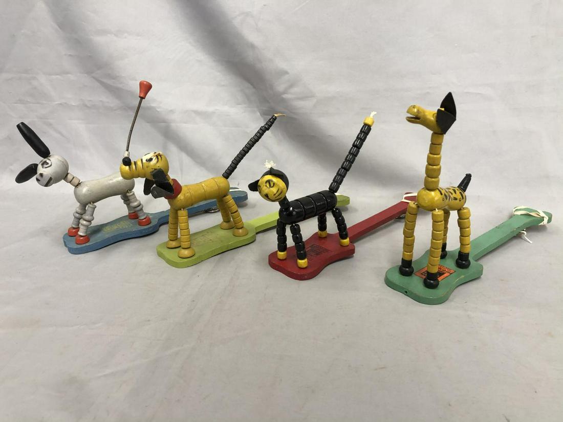 4 Fisher Price Pop-Up Kritters: Includes Giraffe; Cat; Pluto & Donkey, giraffe is restrung, all show light playwear.