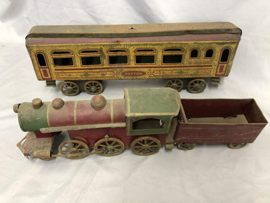 Scarce Dayton Floor Train Set: Painted pressed steel, each unit is 24” long, Circa 1910. Loco/Tender has a functional hill climber mechanism and shows moderate playwear. Scarce Dayton Coach, showing heavy playwear.