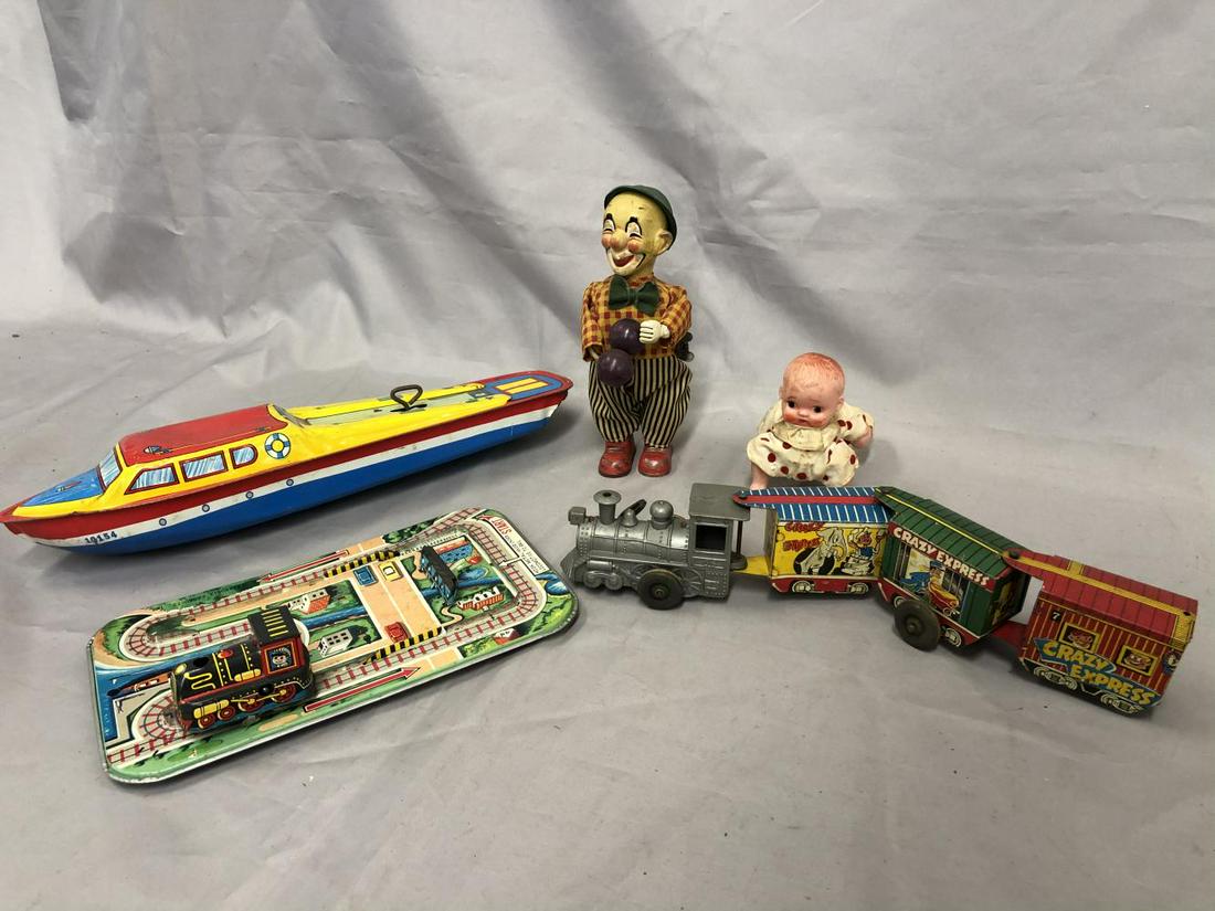 5 Vintage Wind-up Toys: Includes a 14” Chein Yacht, mechanism functions, no prop; Marx Western Express Crazy train, functional; Japanese Train on tin track, train mechanism functions, needs prodding to run; Japanese Crawli