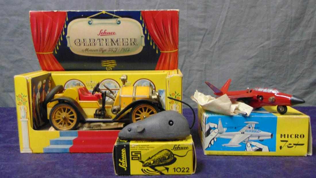3 Boxed Schuco Toys: Includes a 1225 Mercer, mechanism skips when wound with instructions, key and display box, missing 1 gas tank cap; 1022 Mouse, mint with key; 1021 Magister Micro Jet, functioning with key packet, all