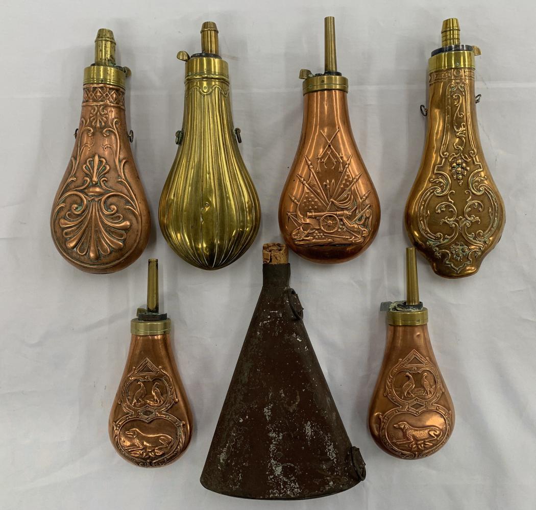 Lot of (7) Powder Flasks.: Various sizes and periods. Largest 8".