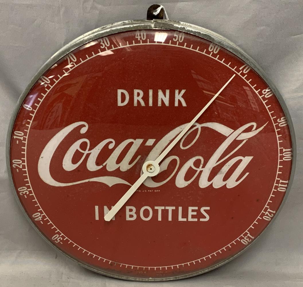 Drink Coca Cola in Bottles Round Thermometer: Circa 1954, bottom edge marked "495A". Approx. 12" diameter. Appears to be working. Some light pitting along the bottom edge. Back is rusted.