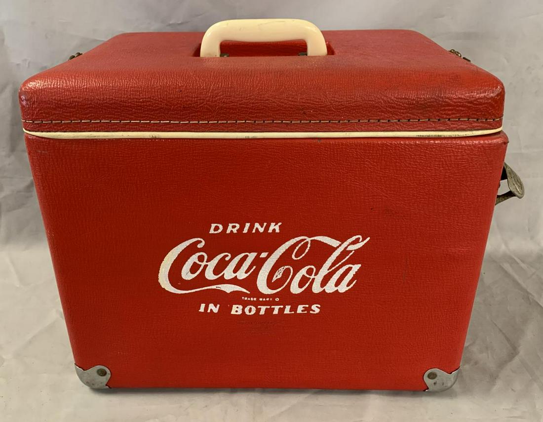 Royal Mieco Coca Cola Hard Vinyl Cooler: Approx. 17" x 14" x 11-1/2". Royal Mieco, made in Clinton, Oklahoma. Features original bottle opener at one end. There is a tray included as well, however it does not appear to belong to this coolor.