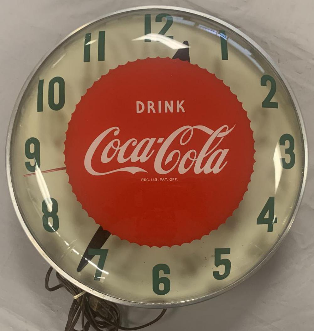 Coca Cola Gear/Bottle Cap Light-Up Clock: Approx. 15" diameter. Tested and only lights up, the clock hands do not move. Some light interior rust on the mechanism.