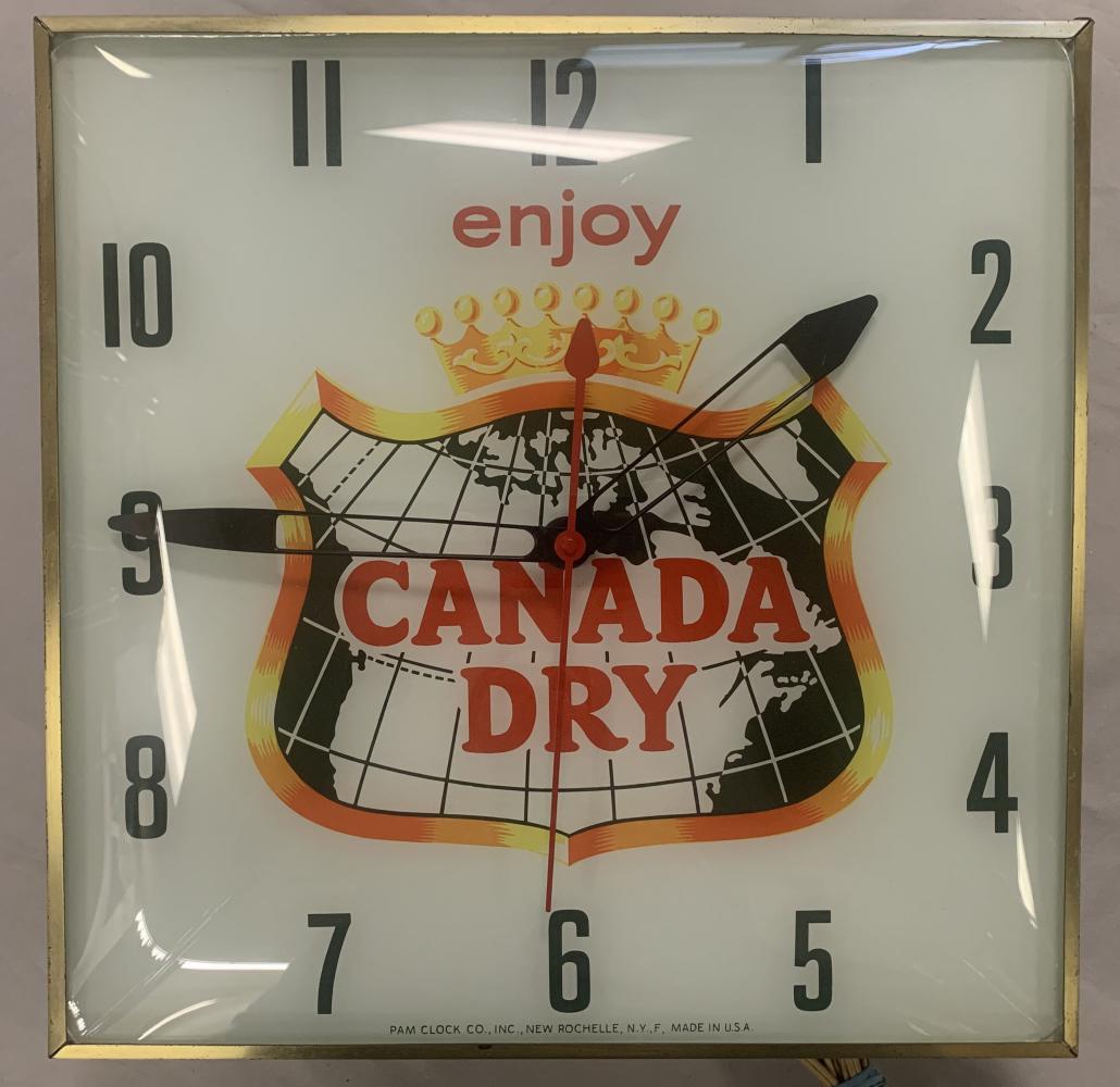 Enjoy Canada Dry Light-Up Advertising Clock: Pam Clock Co., New Rochelle, NY. Approx. 16" x 15". Tested and in working condition. Outer edge wear.