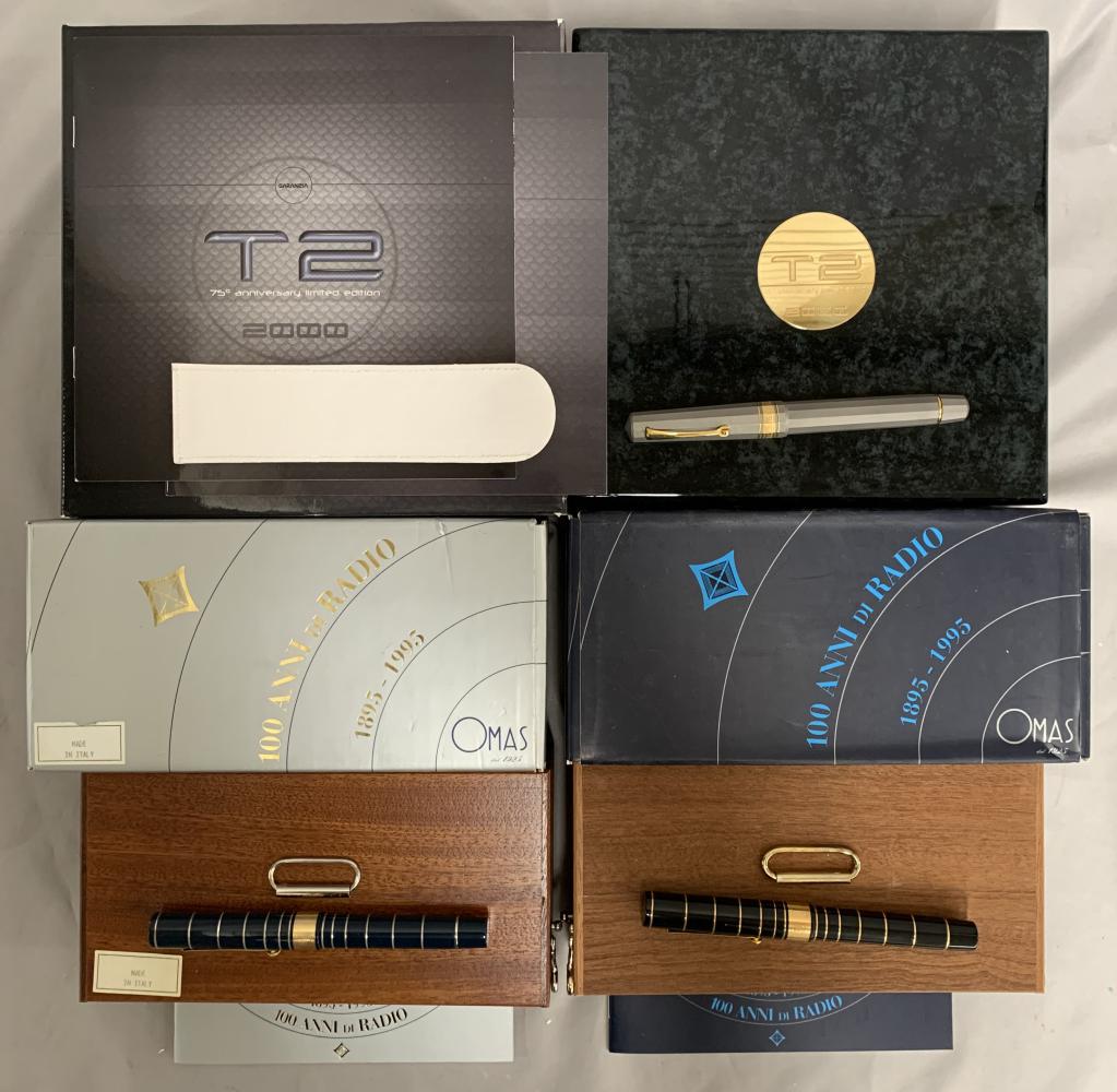 Omas. Fountain Pen Lot of Three.: Lot includes three Limited Edition Pens. Titanium 75th anniversary, 100th Anniversary of Radio (Charcoal) and 100th Anniversary of Radio. All unused complete in boxes.
