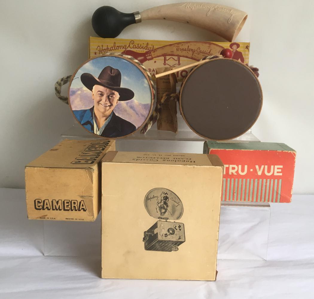 Hopalong Cassidy Lot of (5) Pieces.: Includes Two Hoppy Tom Tom Drums and Drumstick, Hopalong Bar 20 Ranch Bicycle Horn in Box, Hopalong Cassidy Camera Reflector int he box, Empty Camera Box and a Tru Vue Viewer not Hoppy related.