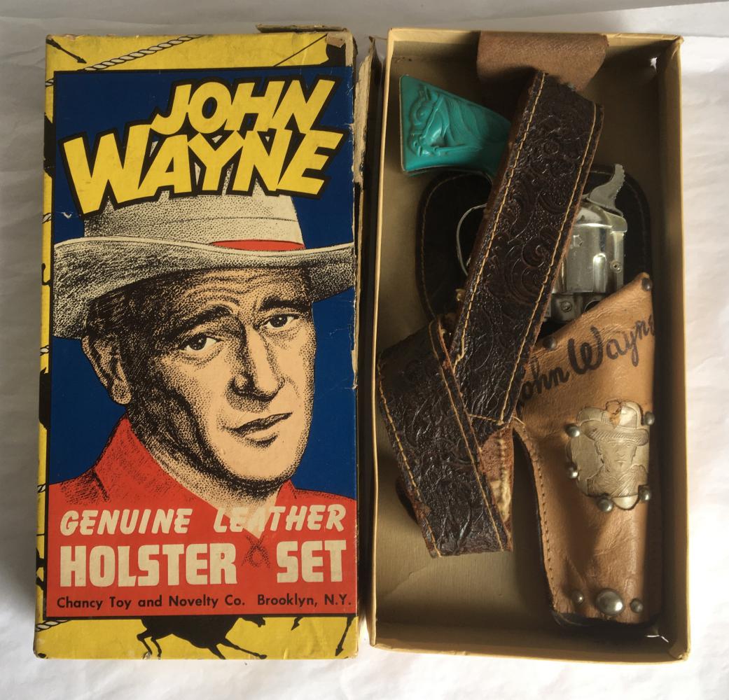 John Wayne Holster Set Boxed.: Leather Holster with Vivid Blue Grips. Single Gun Rig with original box. Box has great Portrait Image of John Wayne. Chancy Toy and Novelty Co.