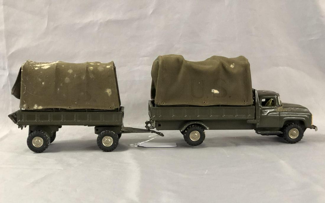 SSS Japan Military Truck & Pup: Litho tin friction with canvas covers, 20” over-all length. It would benefit from a cleaning and show light playwear.