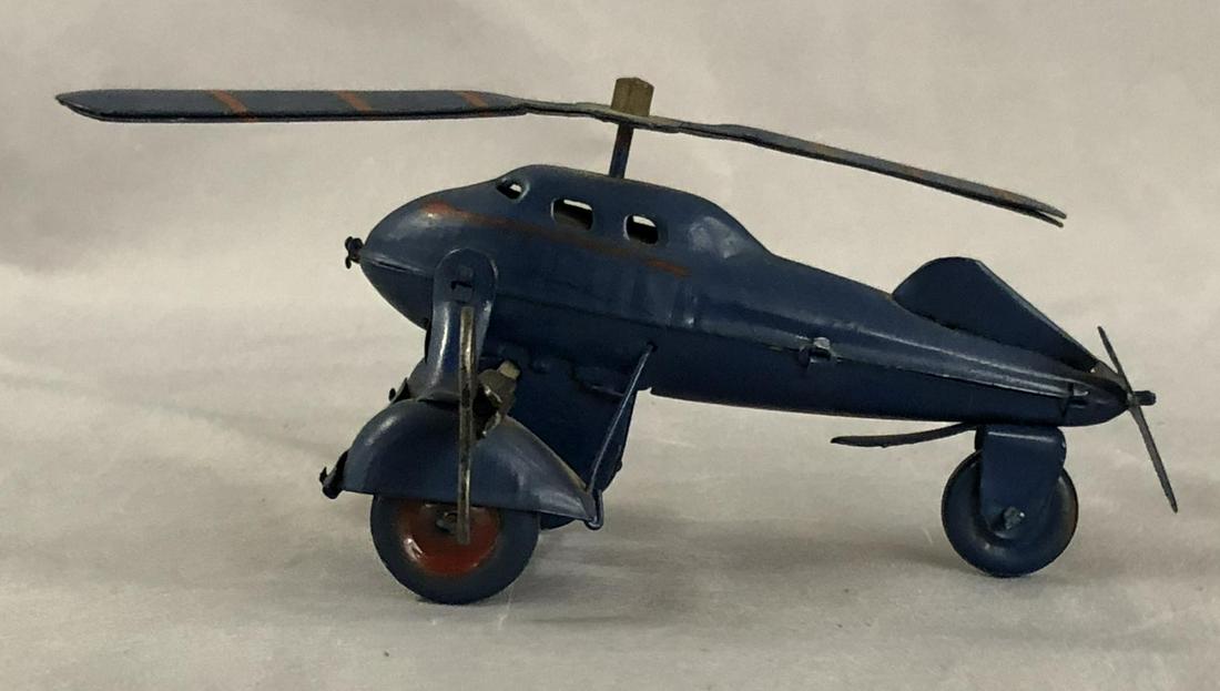 Unusual Prewar Japanese Auto-Gyro: Painted tin with 6” top blade. The mechanism functioned well and shows light use. Nice example!