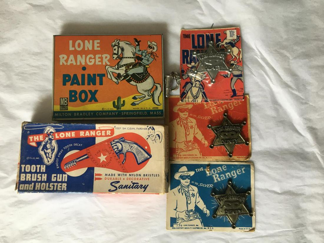 Lone Ranger. (6) Piece Lot.: Lot Includes (3) Carded Badges, Tin Litho Paint Box, Boxed Tooth Brush Gun and Holster and a Bullet Key chain.
