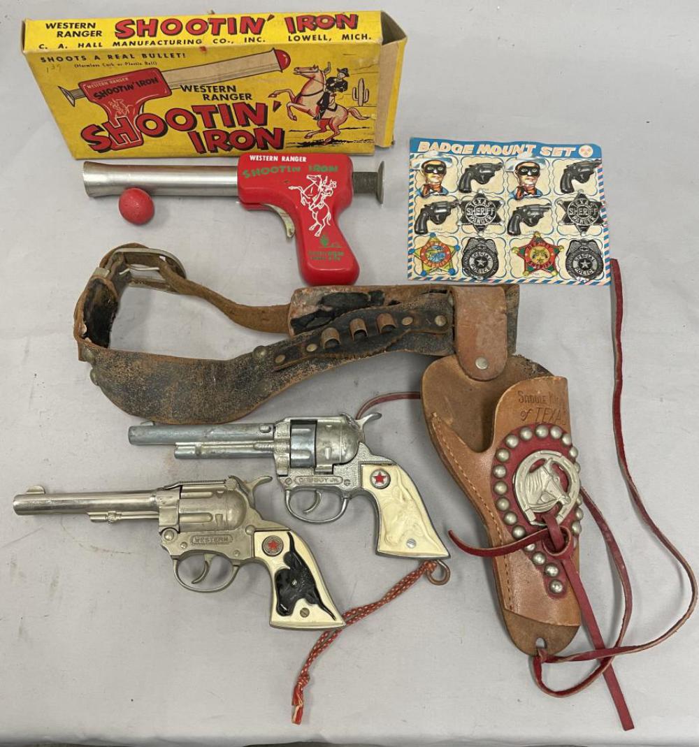 6pc Western Toy & Cap Pistol Group: Includes Lone Ranger style Badge pinback set on card; Boxed S. A. Hall Western Ranger Shootinâ€™ Iron Pop gun with ball; Hubley die cast Cowboy & Western cap pistols, intact and functional with a