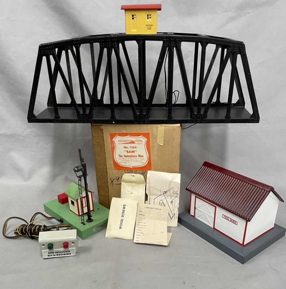 3 Clean American Flyer Accessories: S Gauge. Includes a 758A Sam The Semaphore Man, like new with all accessories and envelopes with nice box; 570 Trestle Bridge; nice 585 Tool Shed. All show light use.
