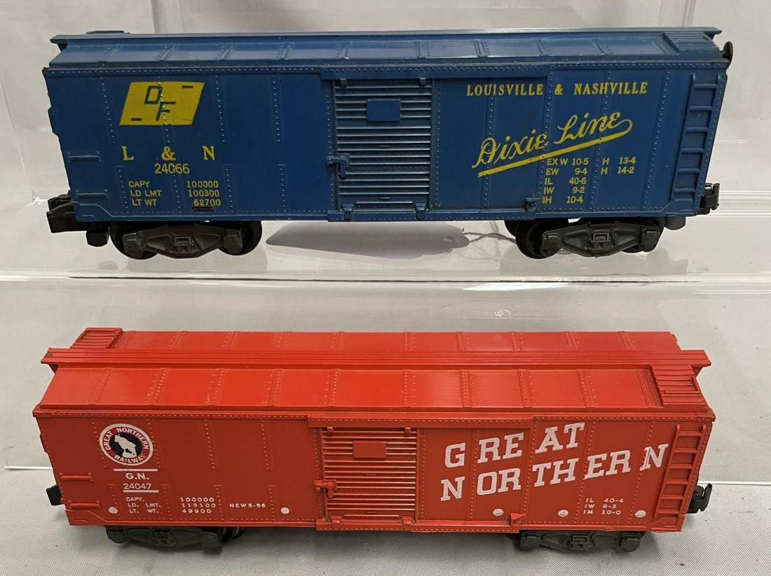 American Flyer 24066 & 24047 Boxcars: S Gauge. Includes a 24066 L&N boxcar with intact brake wheel and catwalk ends; 24047 GN boxcar, has nice stickers, but missing brake-wheel. They show light to moderate playwear. From The Collection Of