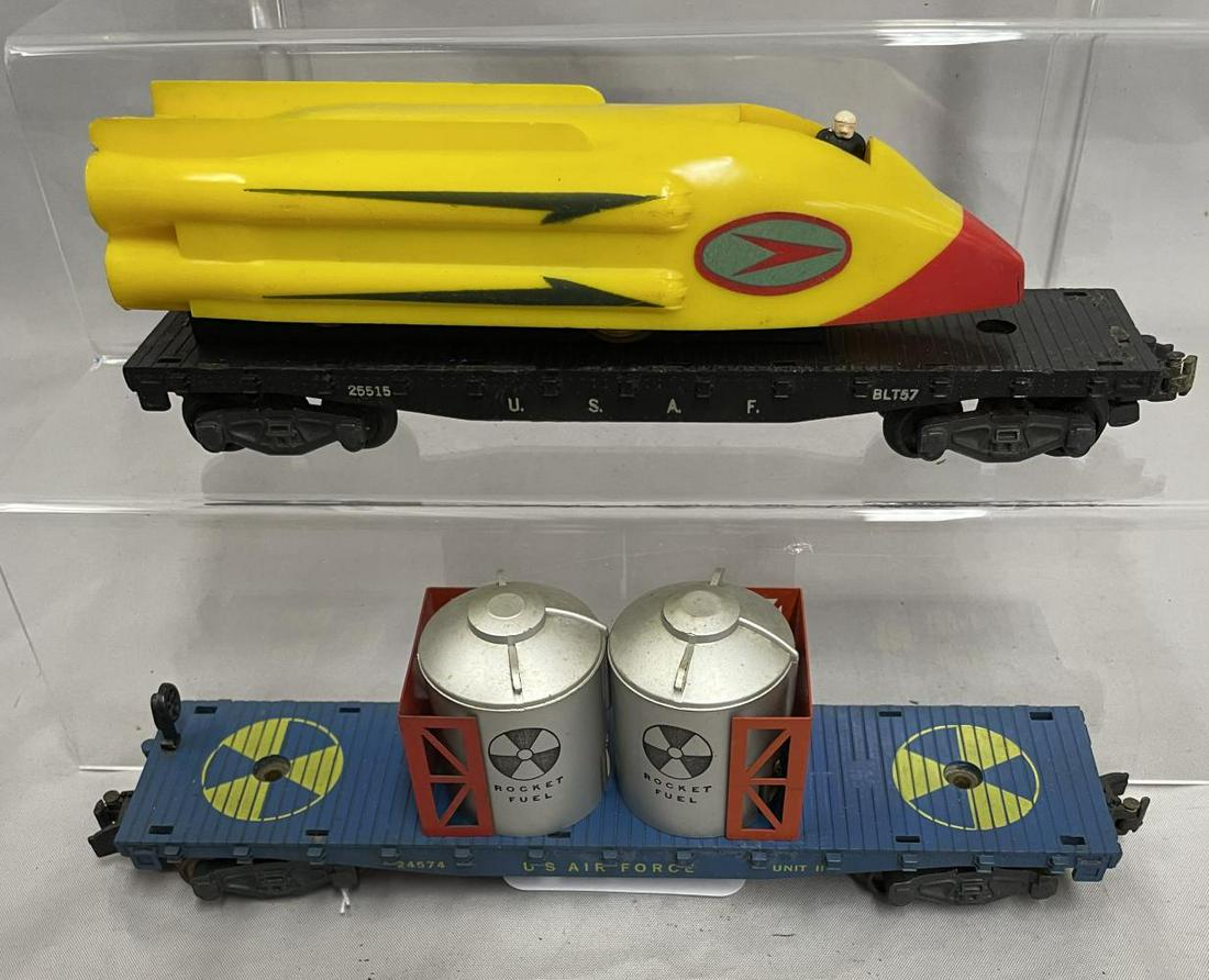 Clean American Flyer 25515 & 24574 Military Cars: S Gauge. Includes a 24574 US Air Force Rocket Fuel Flat, brake-wheel reattached; 25515 Rocket Sled with original driver and spring, flat missing 1 coupler knuckle. They show light to moderate playwear