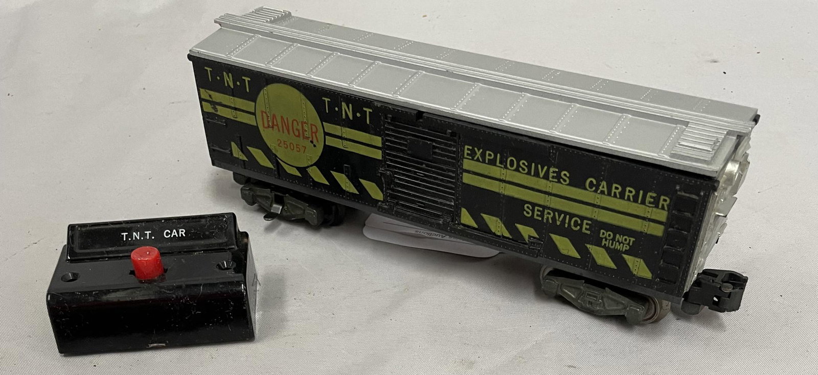 Clean American Flyer 25057 TNT Exploding Car: S Gauge. All parts appear are intact with clean graphics. It includes its button and show light playwear. From The Collection Of Frank Pisani