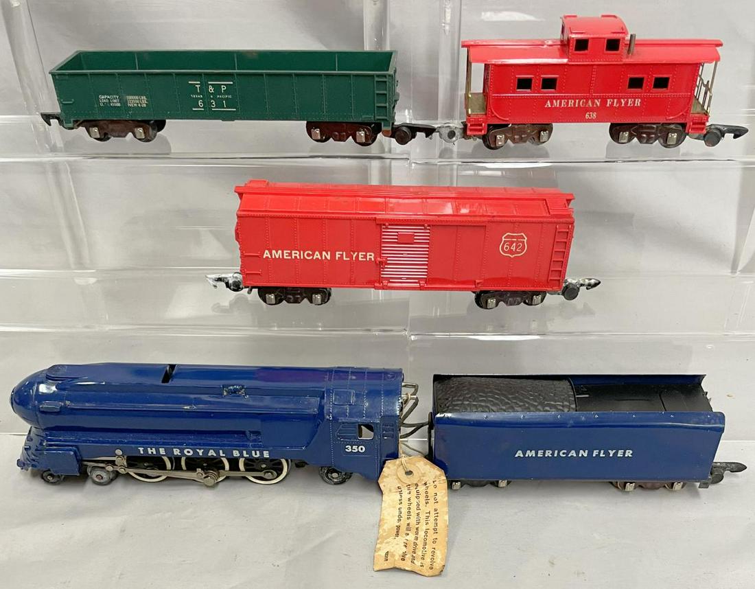 Boxed American Flyer Royal Blue Freight Set #50T: S Gauge. Includes a stunning 350 Royal Blue steam loco with store warning tag; 631 T&P Gondola; 642 boxcar; 638 caboose. All show light handling, clean & shiny, with crushed boxes, set box and track &