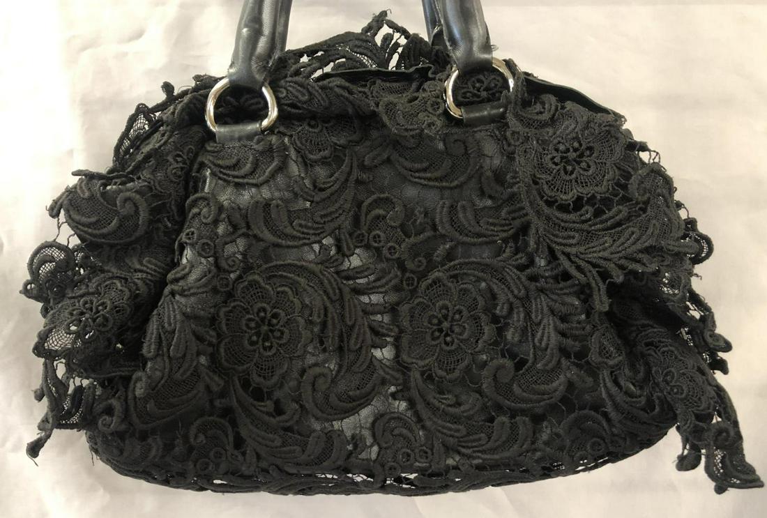 Prada Pocket Book With Lace Like Trim.: 9" x 12" leather bag with lace covering, leather handles show some wear.
