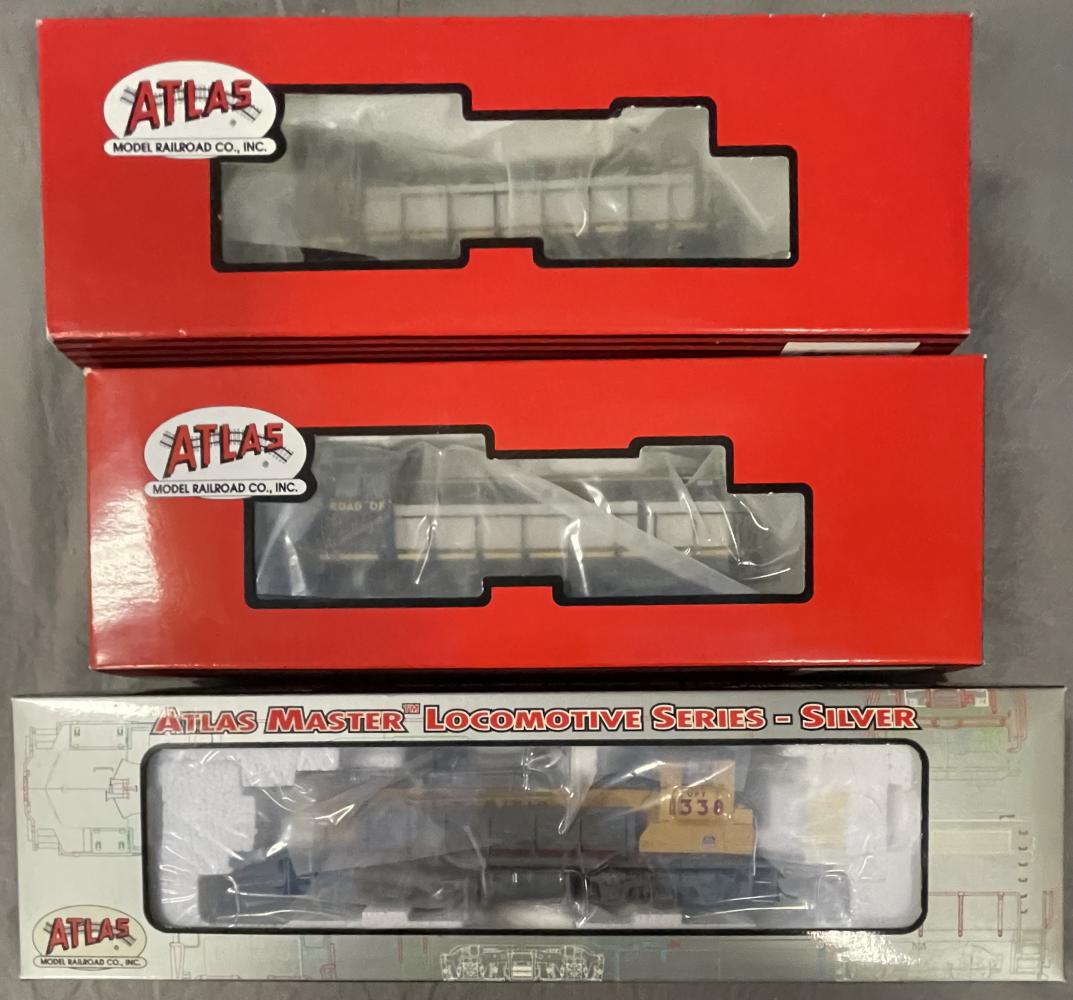 3 Atlas HO Gauge UP Diesels: Includes a 9937 Master Series MP15DC loco #1338; 8746 S2 #1036; 8747 S2 #1038. They appear like new with boxes.