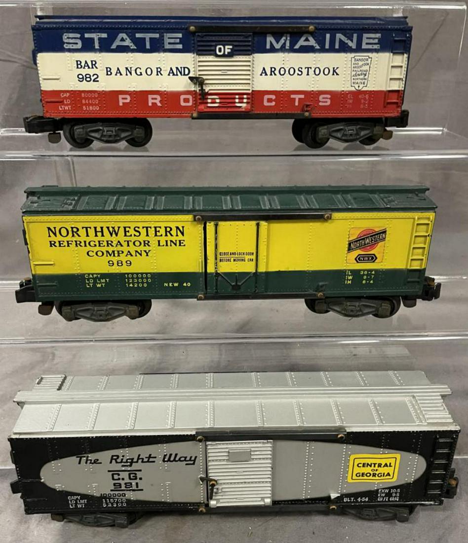 American Flyer 981, 982 & 989 Freight Cars: S Gauge. Includes a 982 SOM Boxcar, missing brake-wheel; 981 C of G, satin finish, nice stickers; 989 CNW Reefer, nice stickers, all have oxidation on rivets. From the Estate Collection of Frank Pisan