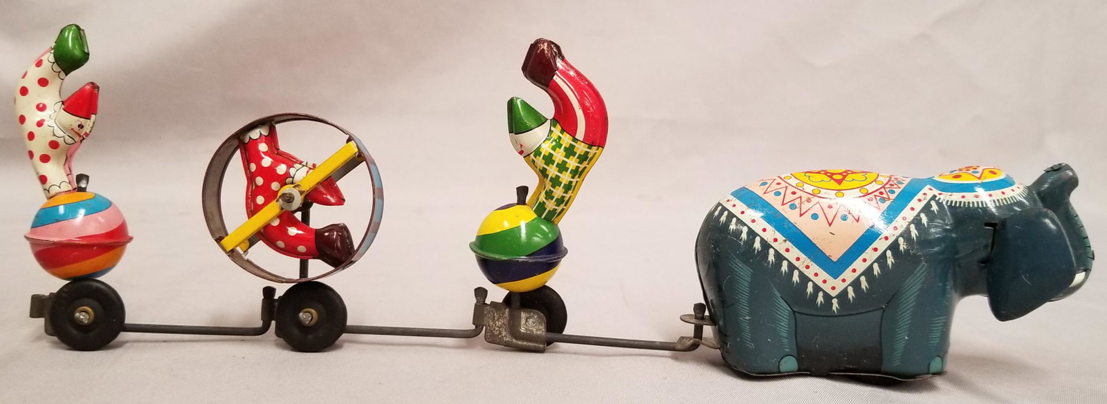 TPS Circus Parade Tin Wind Up.: Elephant pulls three clowns. When tested it was in good working order. 12" long.
