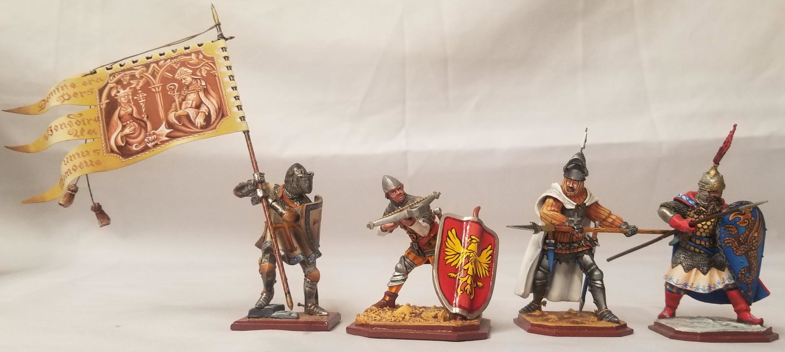 (4) St. Petersburg Footed Knights: Hand painted and highly detailed. Includes 3183.2 knight with spear, 367 knight with crossbow and shield barrier, 399 knight with spear and shield, and knight with pennant. Three are signed underneath