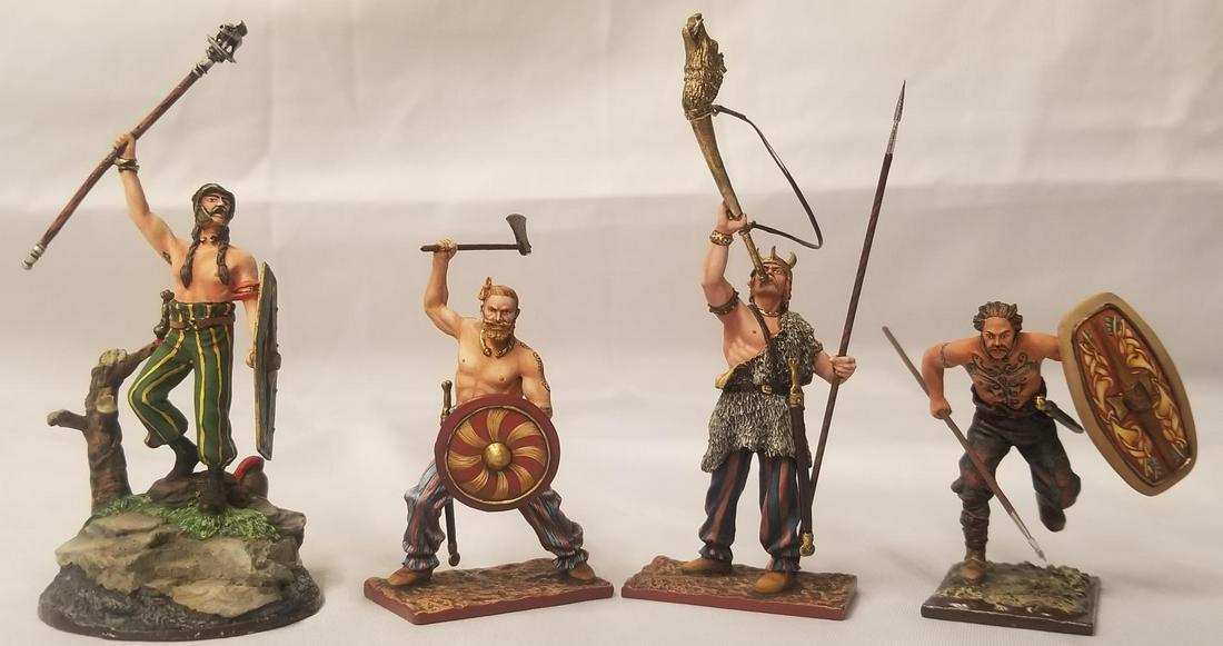 (4) St. Petersburg Viking Footed Figures: Hand painted and highly detailed. Includes 6175 figure with spear and shield, 2013 figure blowing horn and holding spear, 2012 figure with axe and shield, and unmarked figure standing on stump with sh