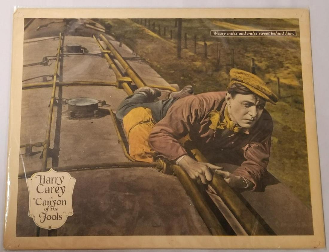 Lobby Card - Harry Carey in "Canyon of the Fools": Canyon of the Fools featuring Harry Carey captioned "Weary miles and miles swept behind him". Measures 14" x 11". Overall good condition with pin holes in four corners