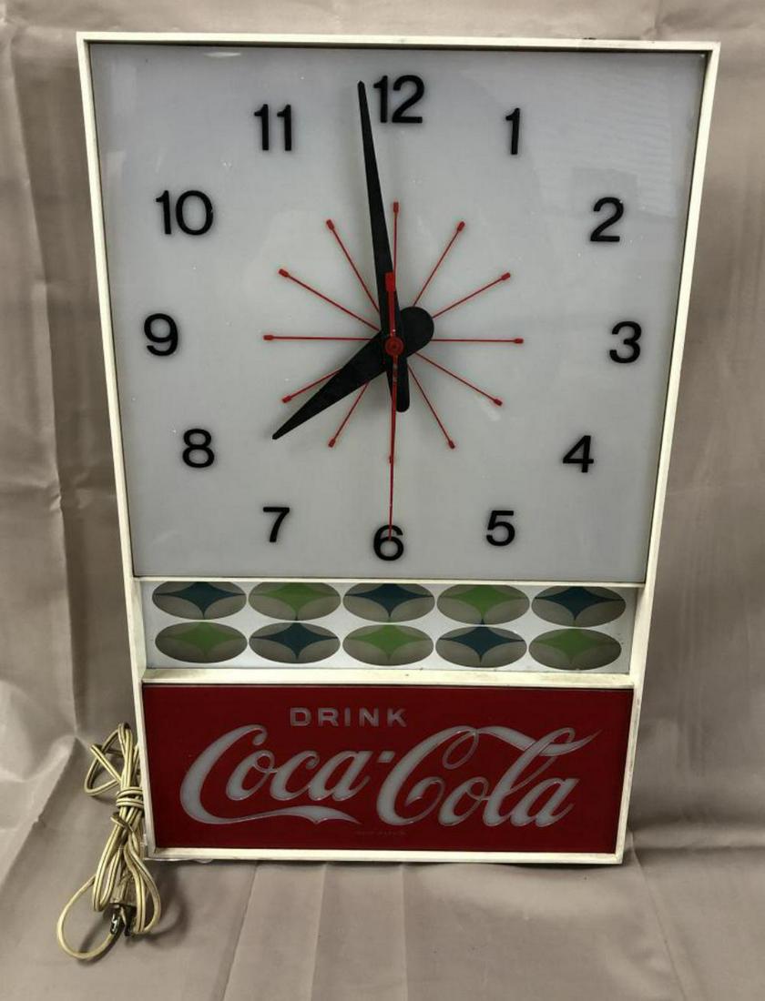 1960's Drink Coca Cola Light Up Plastic Clock: Working condition when tested. Light up plastic clock, approx. 11-1/2" x 20" x 4-1/4". Clock hands show light wear, seconds hand has some red paint loss, and has some light waves. Sticker on verso mar